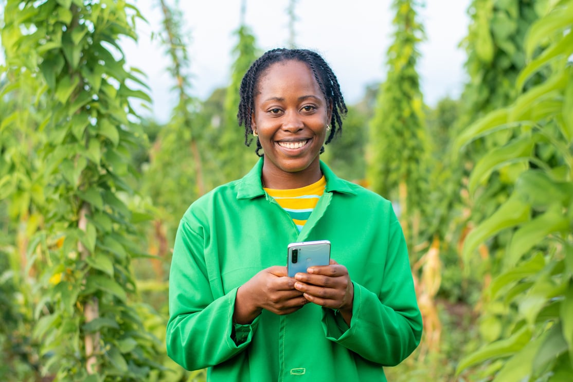 Female Farmer Holding a Phone