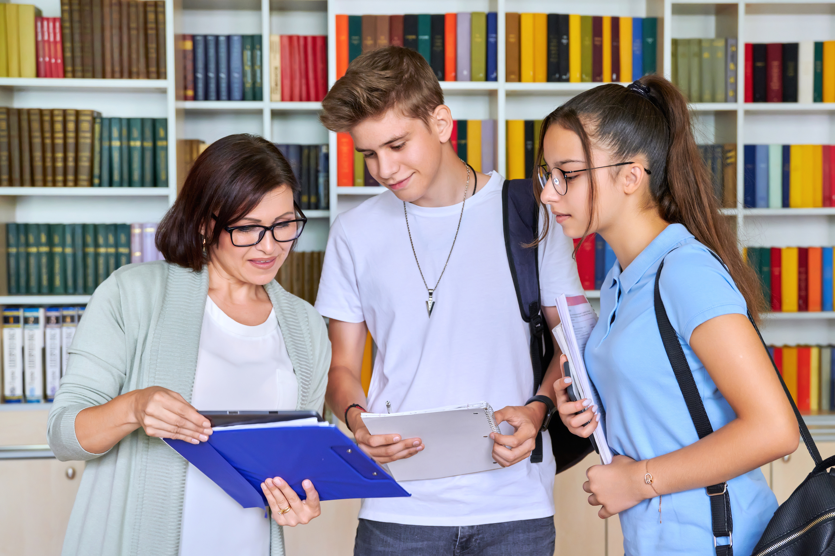 Students Teenagers Talking with Woman Teacher Mentor